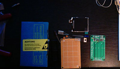 Bunch of parts, quarz, ATMega32L-PI8 MCU, Nokia LCD 6100, capacitors, voltage regulator TC12643.3VAB Microchip, PCB board